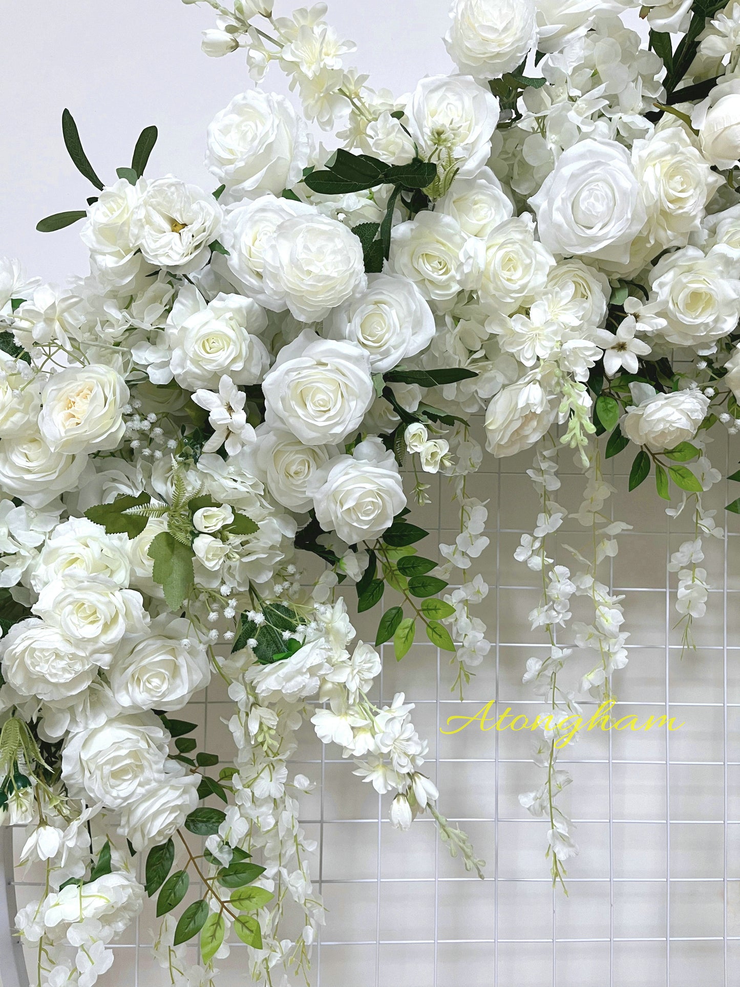 Artificial table runner with roses and greenery