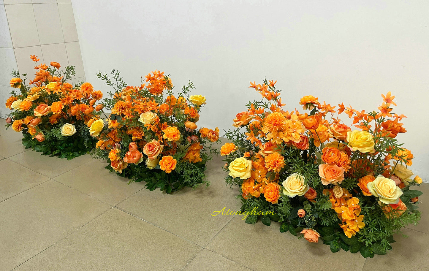 close up autumn orange wedding flower floor arrangement