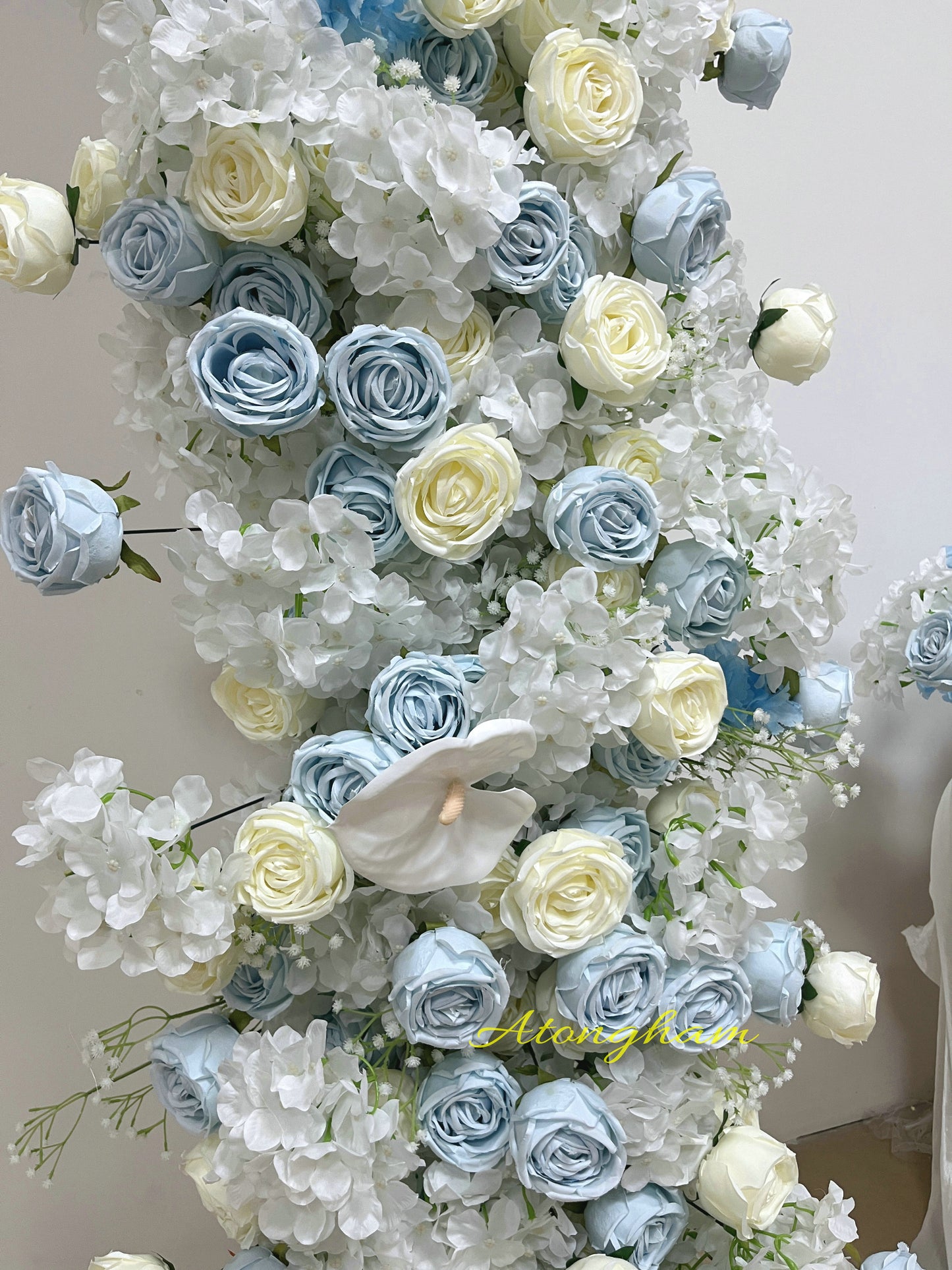 close up haze blue wedding flower floor arrangement