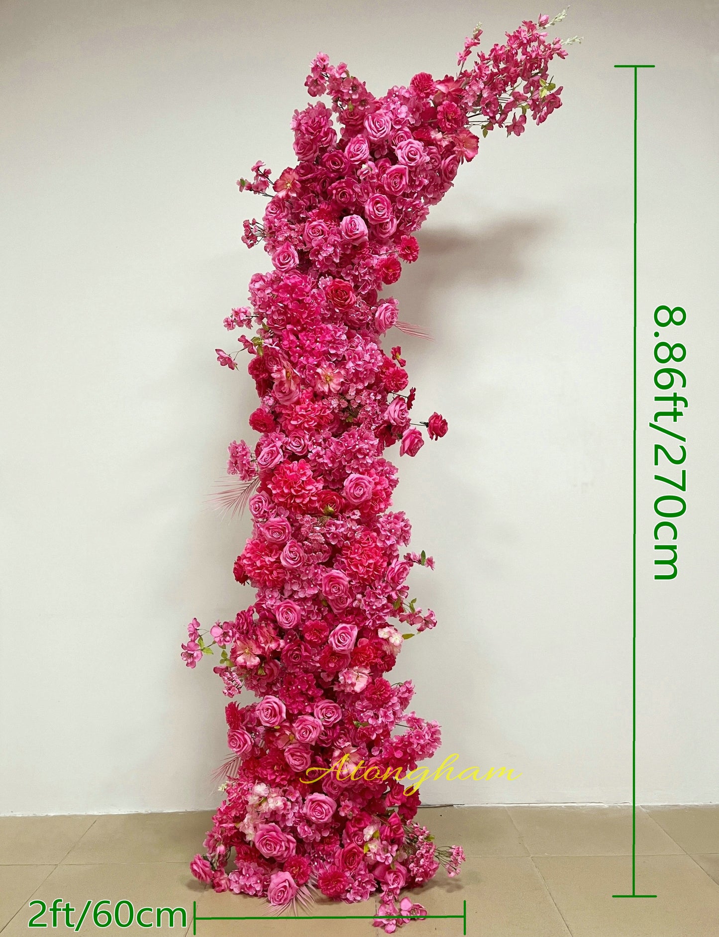 close up hot pink wedding arch flower arrangement