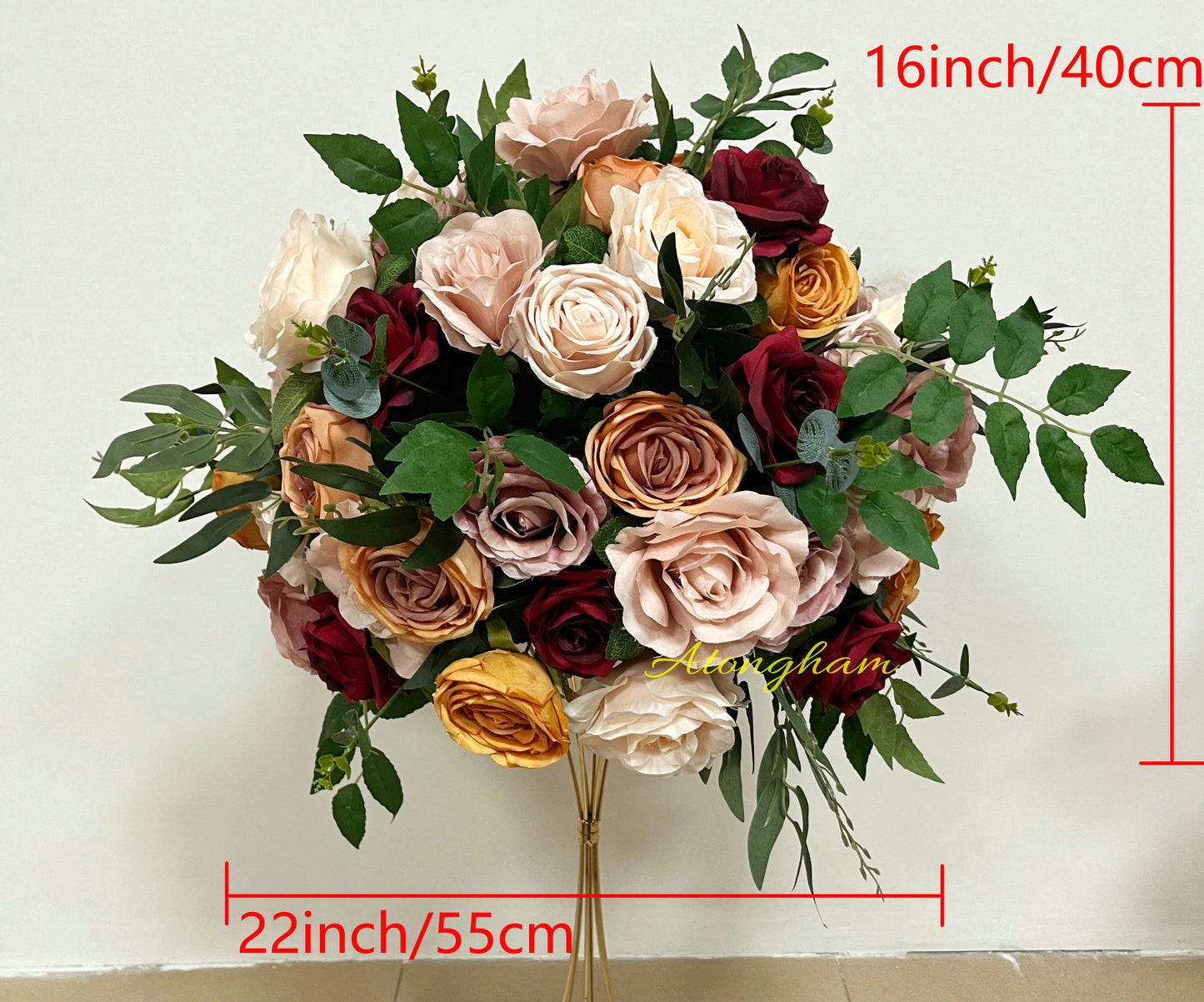 rustic artificial flower centerpiece in pink and terracotta