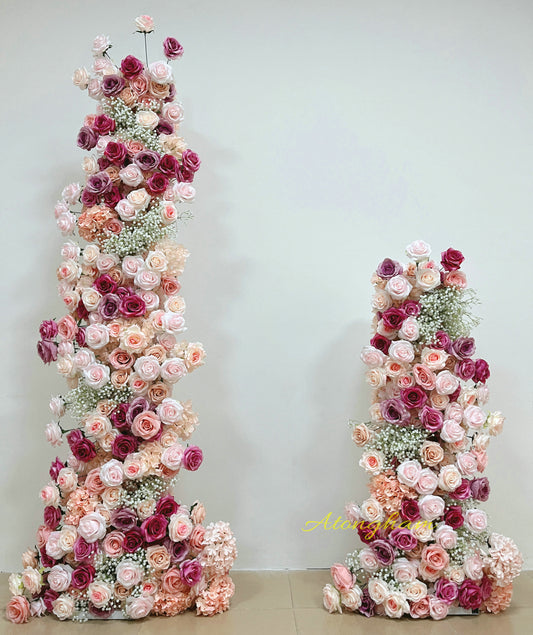 Fuchsia and peach wedding arch flower arrangement