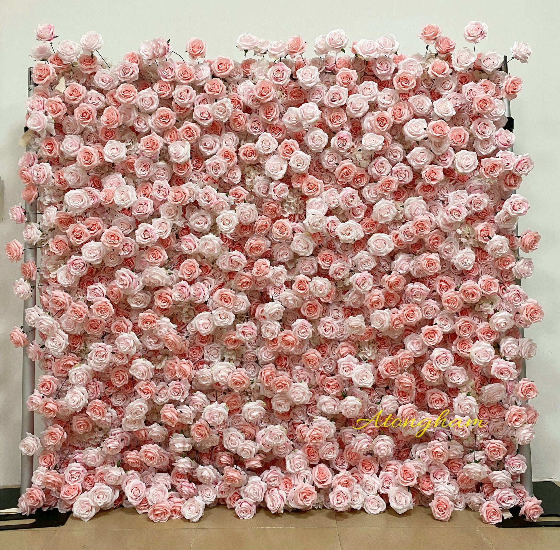 Light pink artificial flower wall backdrop