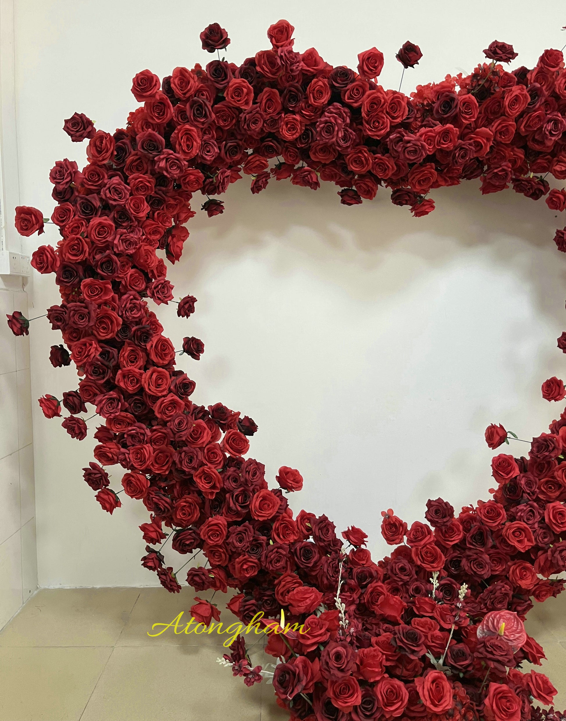 artificial burgundy and red flowers for ceremony arch