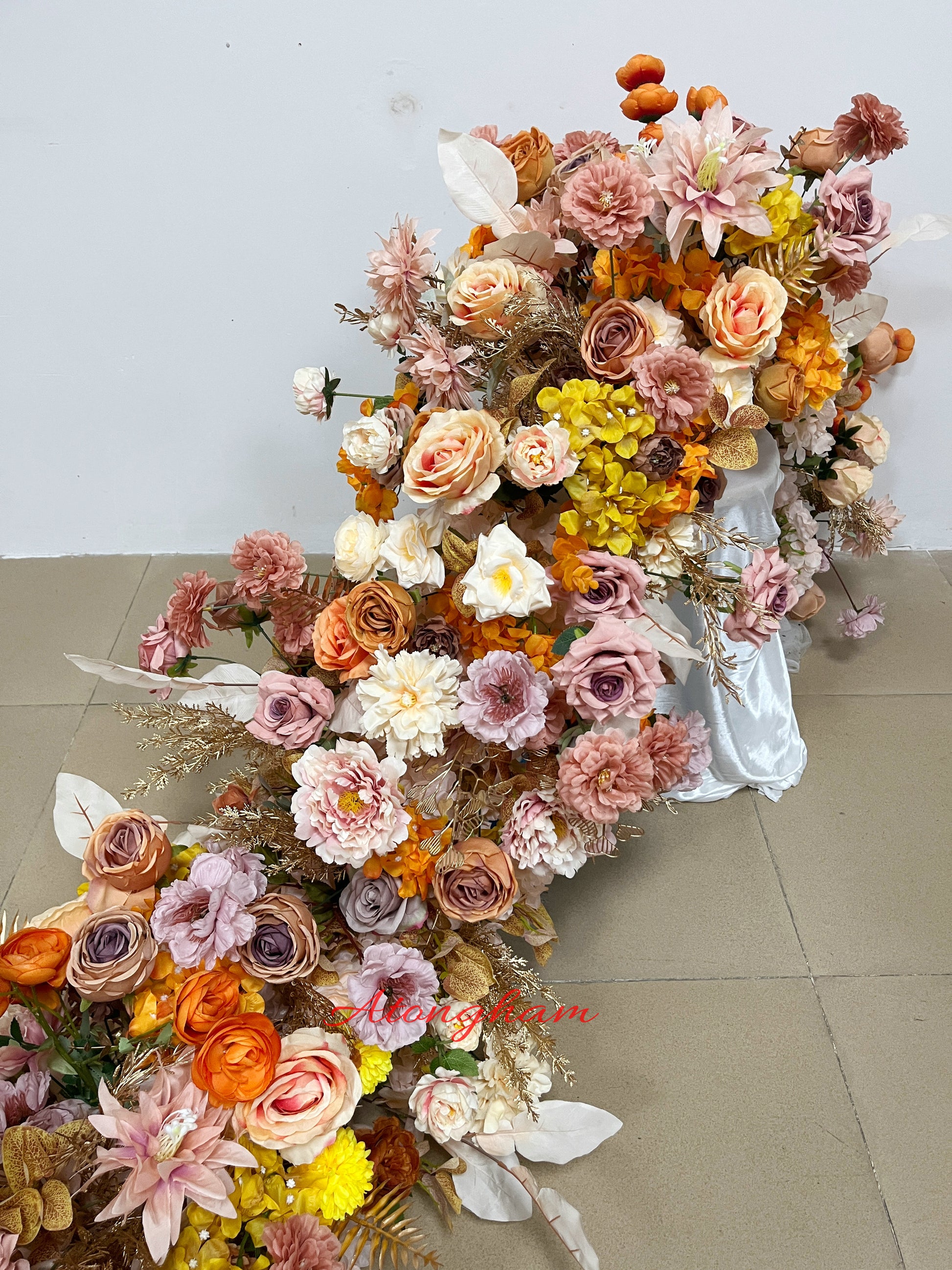 autumn-inspired orange floral runner for receptions