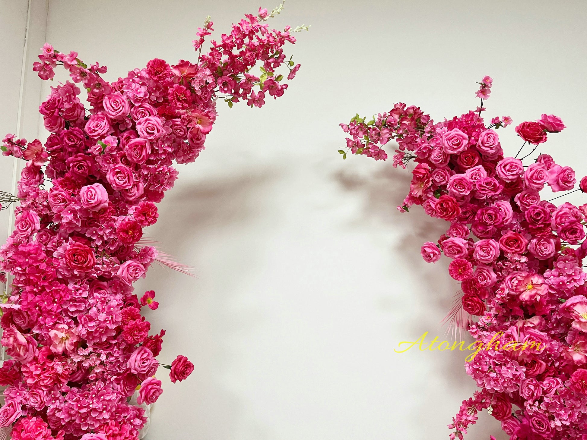 bold wedding arch floral decoration in hot pink