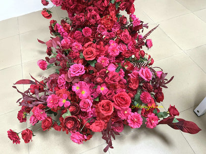 close up artificial wedding arch flower garland pink red