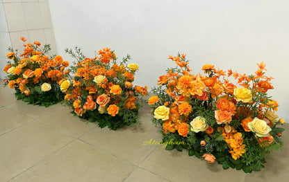 close up autumn orange wedding flower floor arrangement