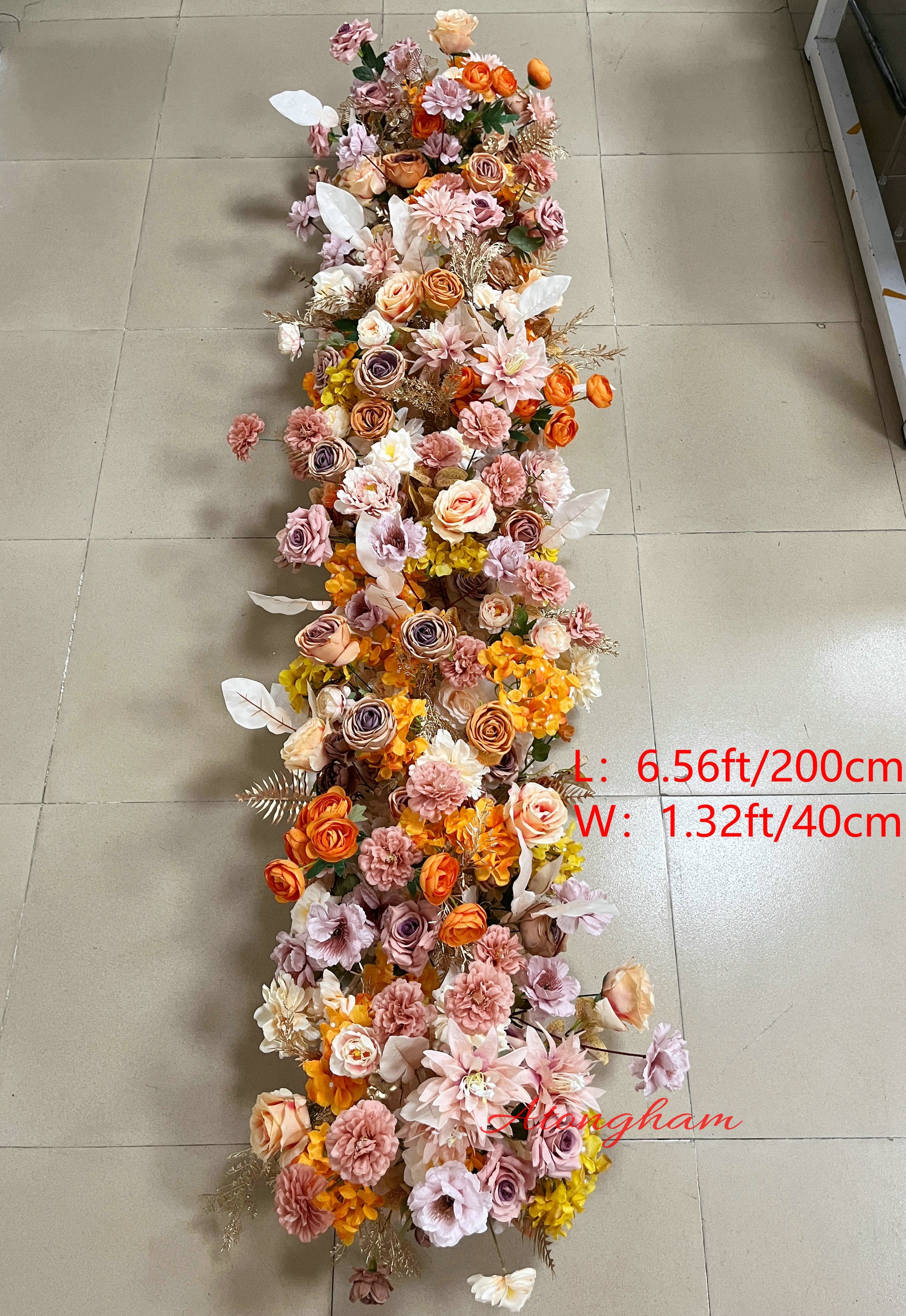 close up burnt orange terracotta wedding flower garland