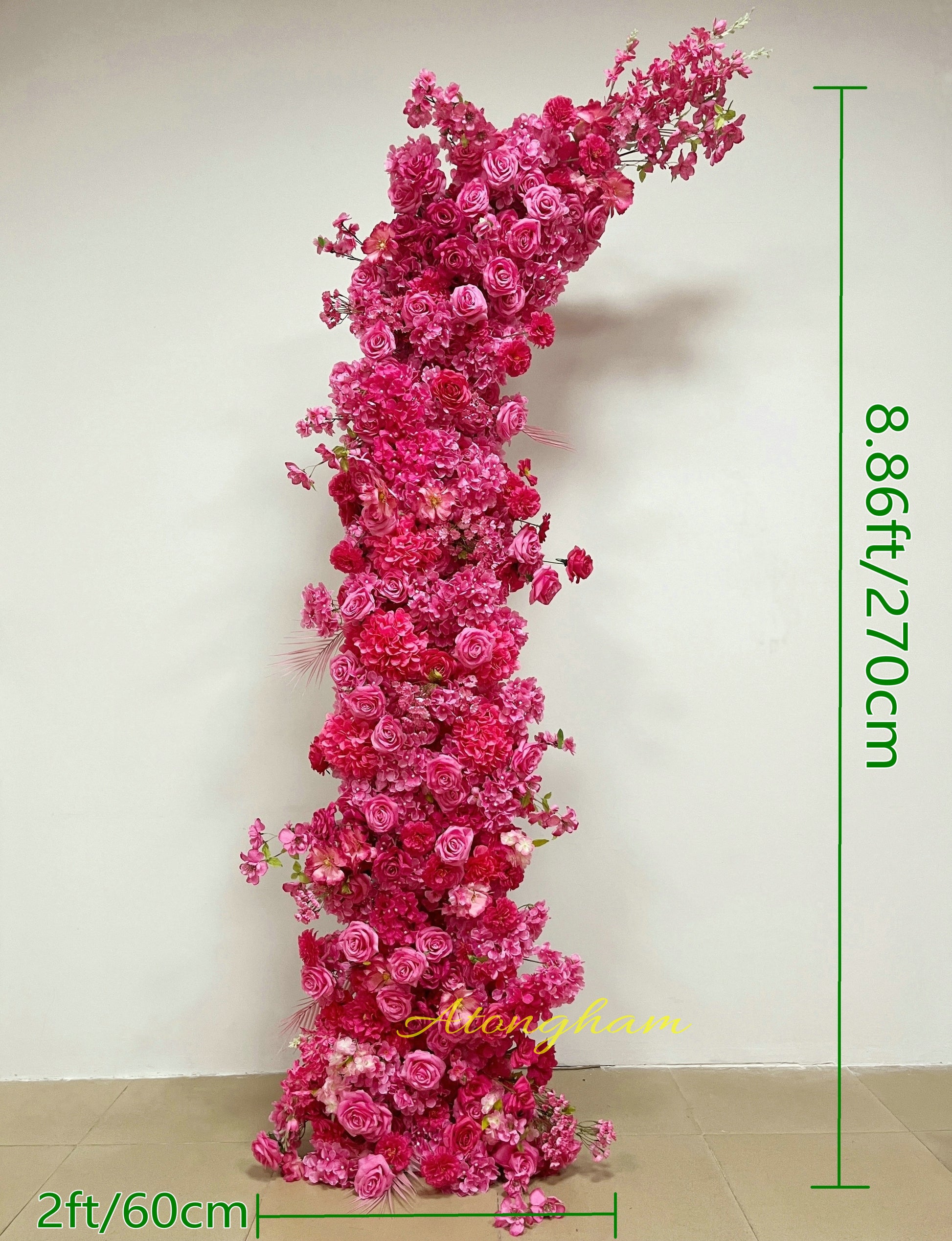 close up hot pink wedding arch flower arrangement