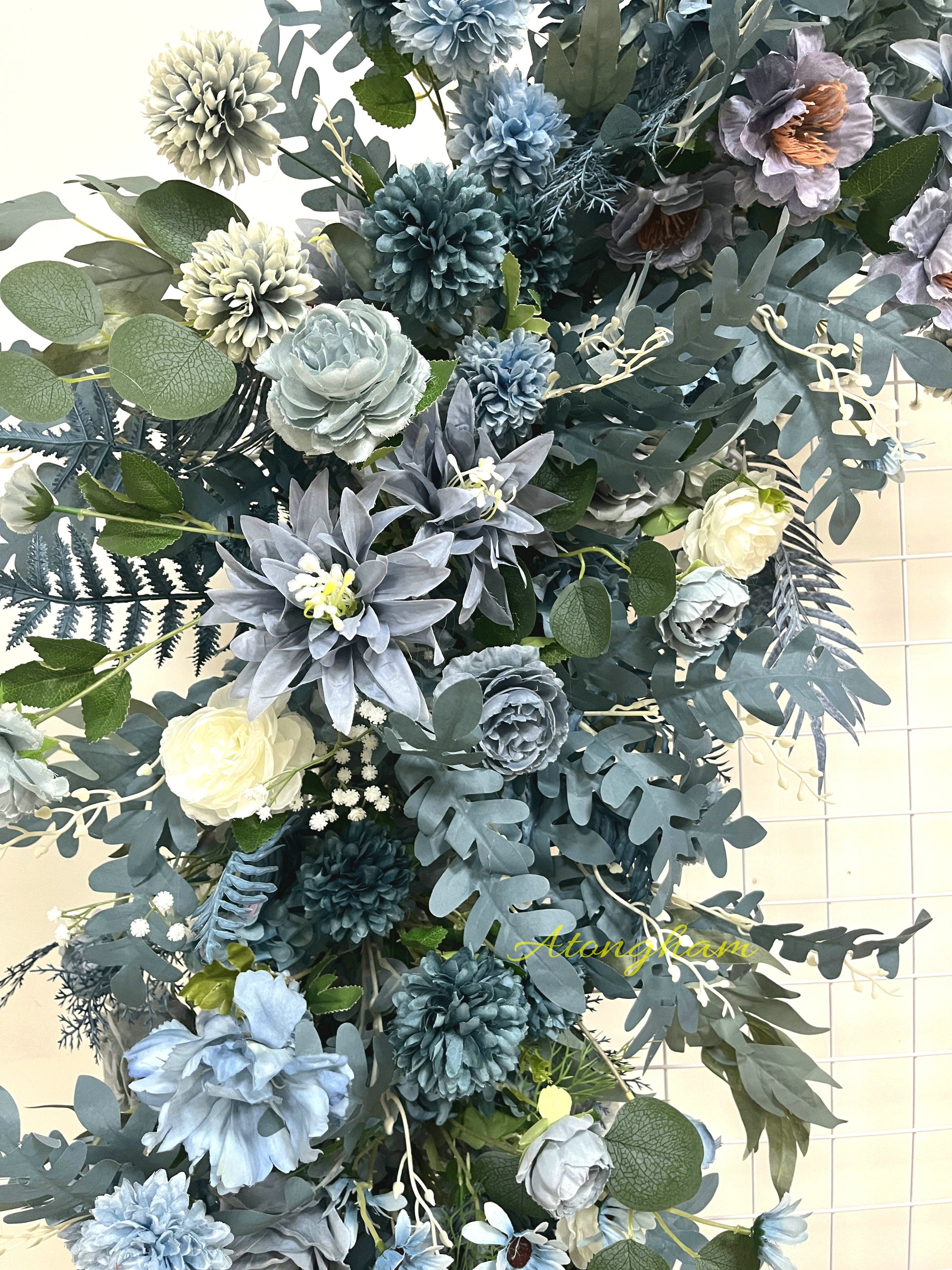 dusty blue floral garland arrangement for ceremony backdrop