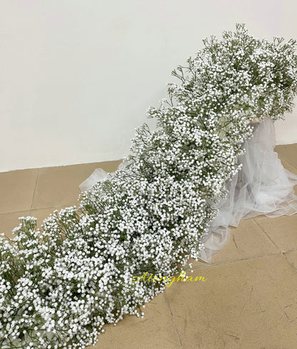 white gypsophila flower runner for wedding aisle
